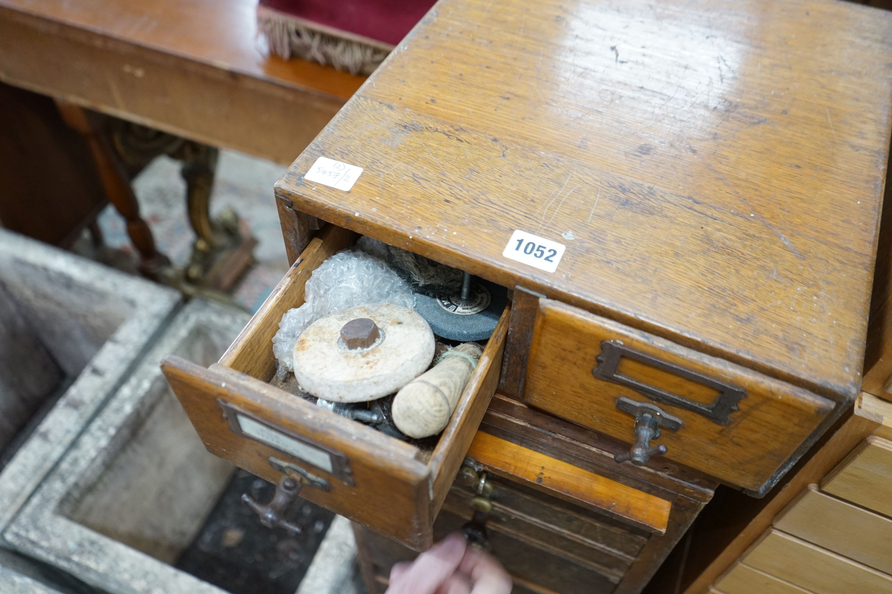 A vintage 11 drawer narrow chest containing assorted tools, height 108cm, together with an oak two drawer filing chest